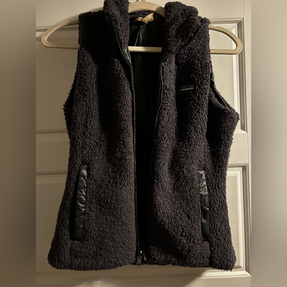 Women’s reversible Patagonia vest in plum.